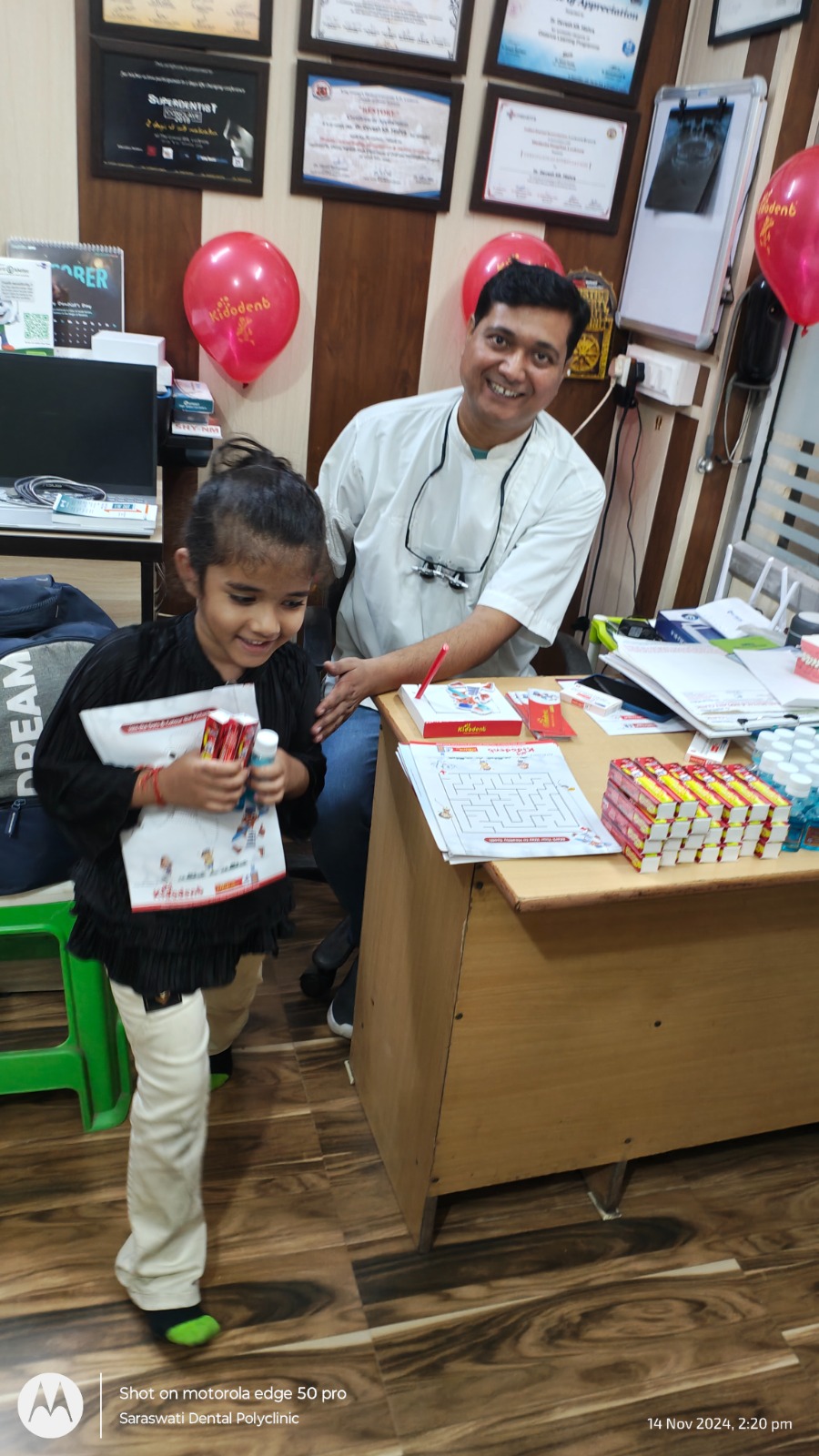 Dr. Mishra with child at pediatric dental camp